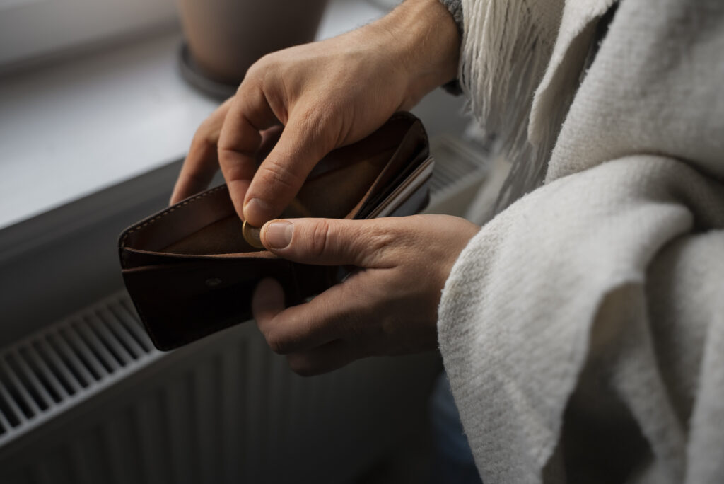 man saving money energy crisis