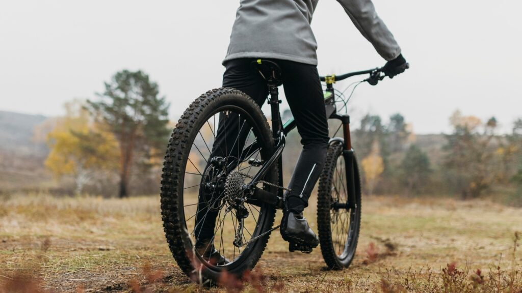 full shot man riding bike