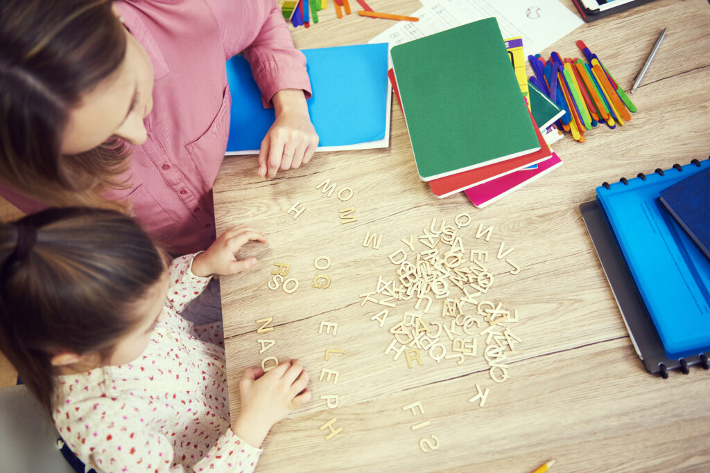 girl learning alphabet home