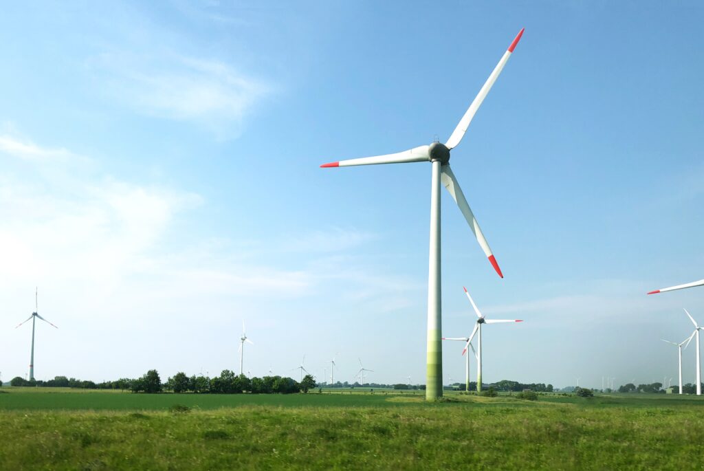 scenery wind turbines middle field clear sky