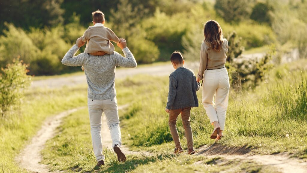 cute family playing summer field